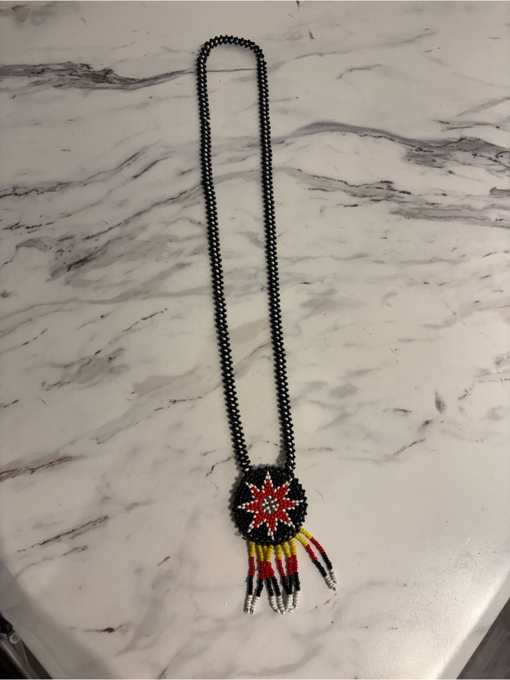 Vintage Indigenous beaded necklace with medallion Native American artwork
